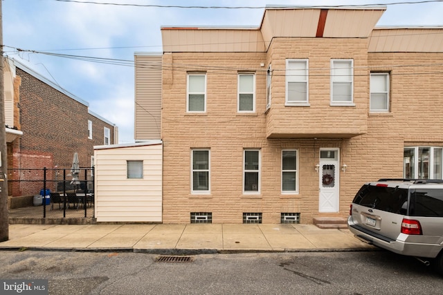 multi unit property featuring fence and entry steps