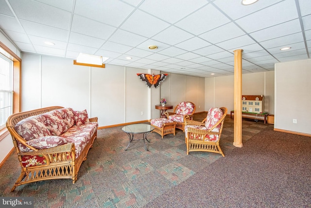 sitting room featuring a paneled ceiling, carpet, and baseboards