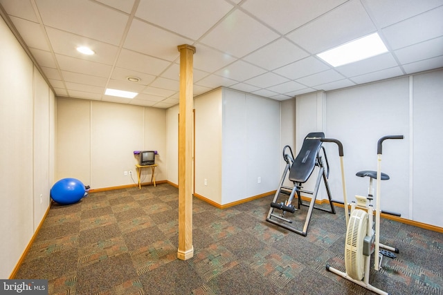 workout room featuring a drop ceiling