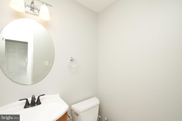 bathroom with toilet and a sink