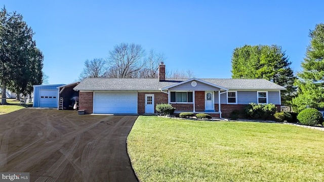 ranch-style home with an attached garage, brick siding, driveway, a chimney, and a front yard