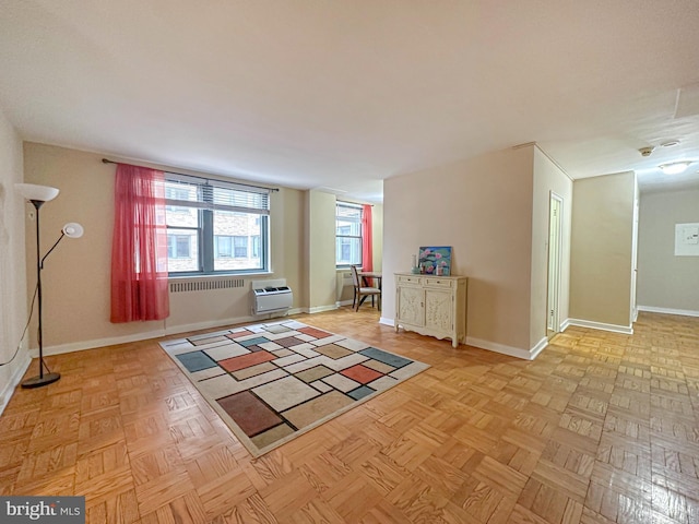 interior space featuring an AC wall unit and baseboards