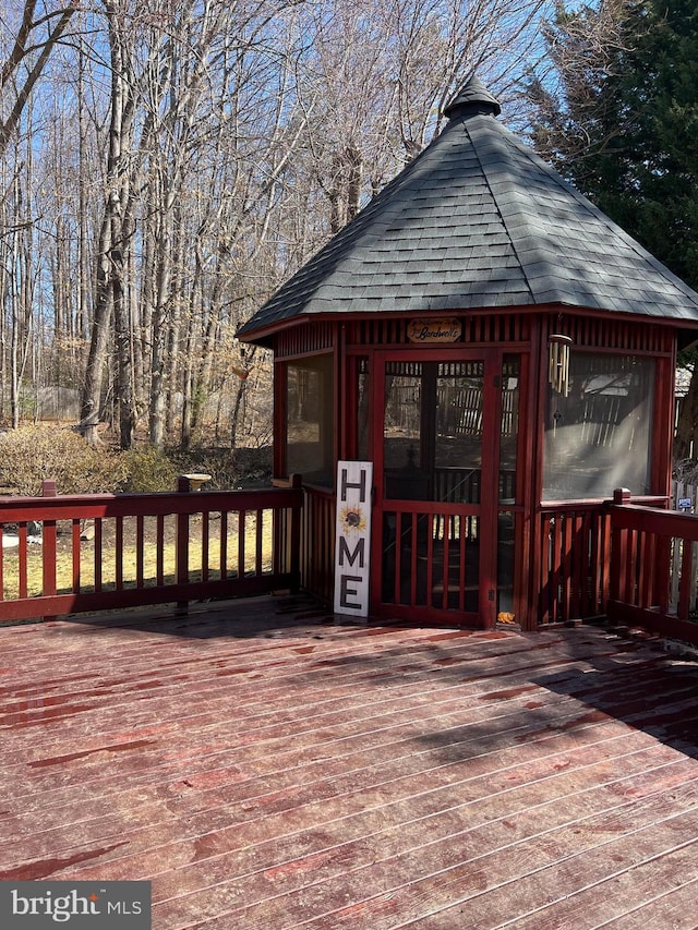 wooden deck with an outdoor structure