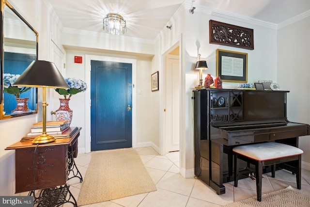 entryway featuring ornamental molding, light tile patterned flooring, and baseboards