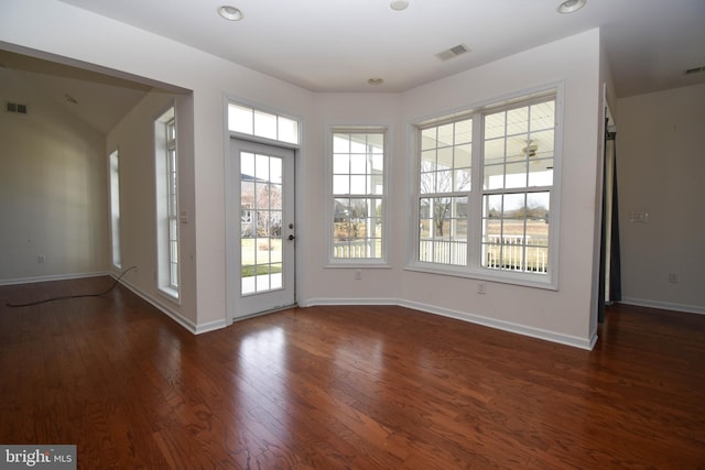 entryway featuring visible vents, baseboards, and wood finished floors