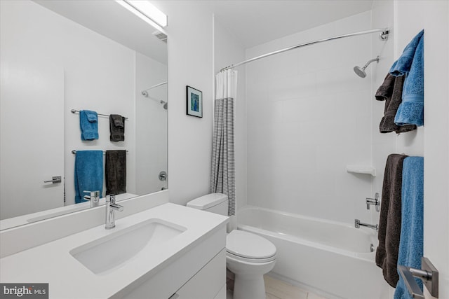 bathroom with toilet, vanity, and shower / bathtub combination with curtain