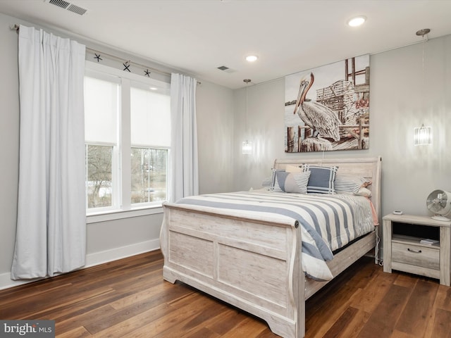 bedroom featuring recessed lighting, visible vents, dark wood finished floors, and baseboards