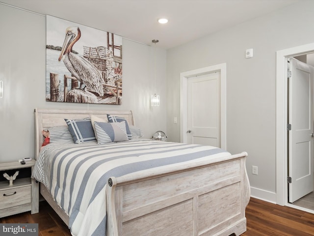 bedroom featuring baseboards, dark wood-style flooring, and recessed lighting