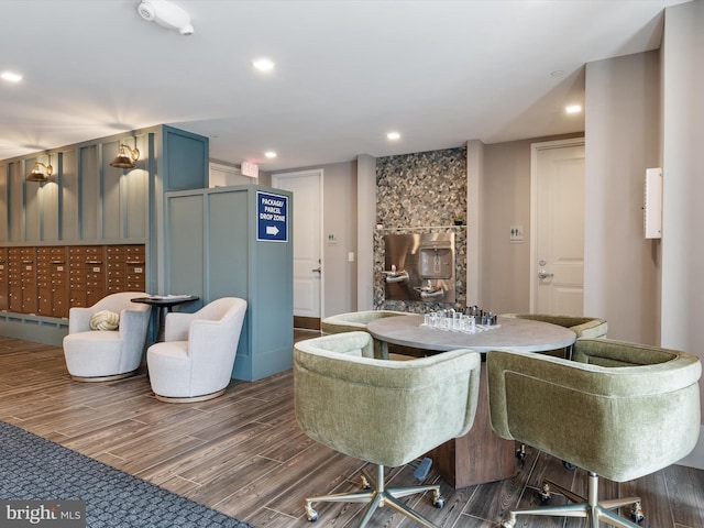 dining area with mail area, dark wood finished floors, and recessed lighting