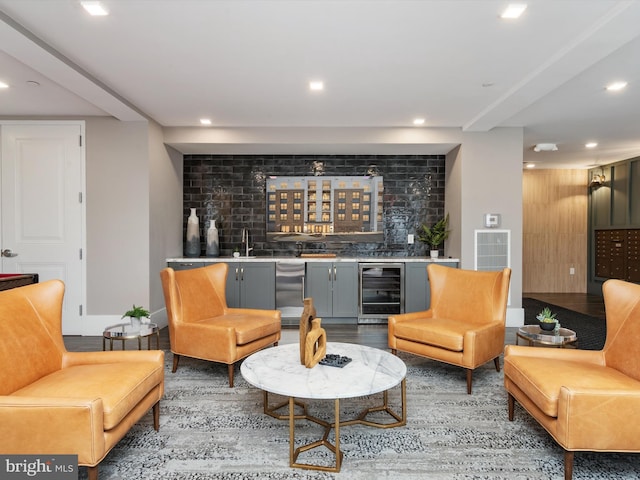 living area with wine cooler, wet bar, and recessed lighting