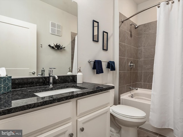 bathroom featuring vanity, toilet, and shower / tub combo with curtain