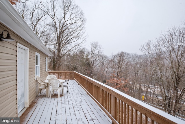 wooden deck featuring outdoor dining area