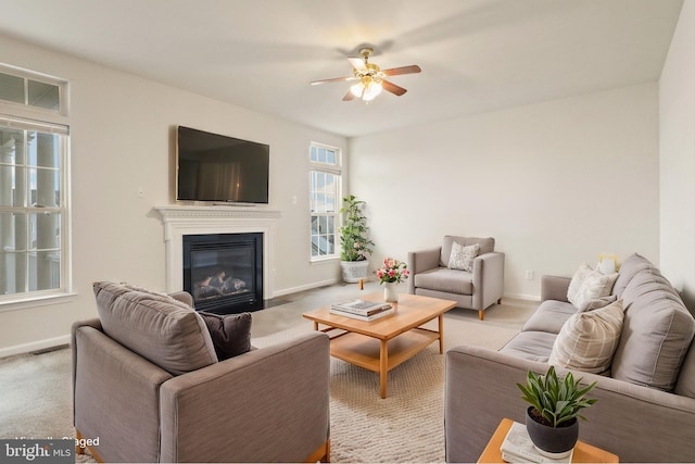 living room with light carpet, a fireplace with flush hearth, visible vents, and baseboards