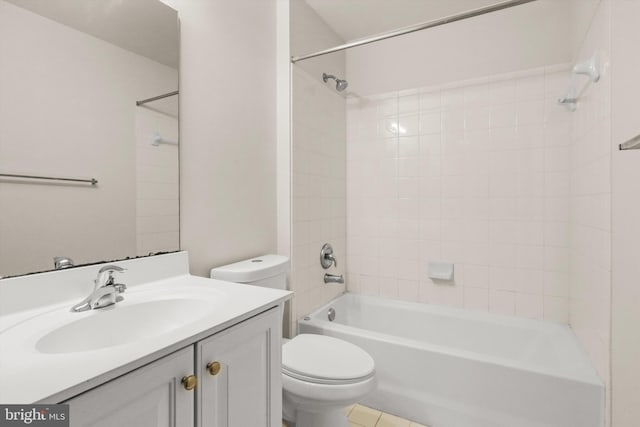 bathroom featuring toilet, shower / bathing tub combination, and vanity