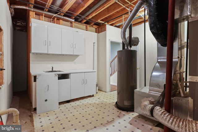 unfinished basement featuring light floors, stairway, gas water heater, and a sink