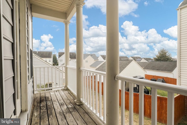 wooden terrace with a residential view