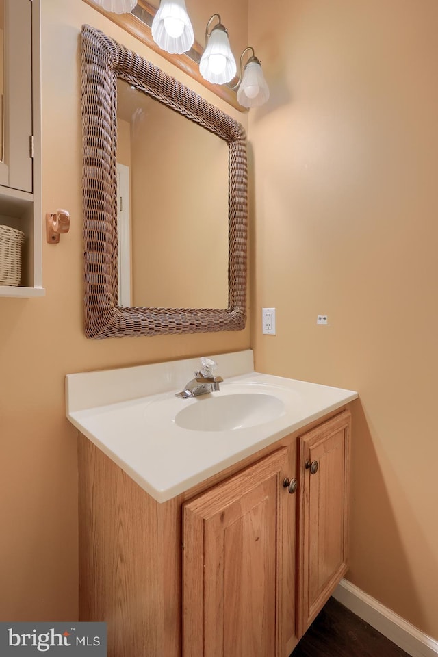 bathroom with vanity and baseboards