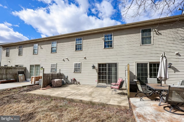 rear view of property with a patio area and fence