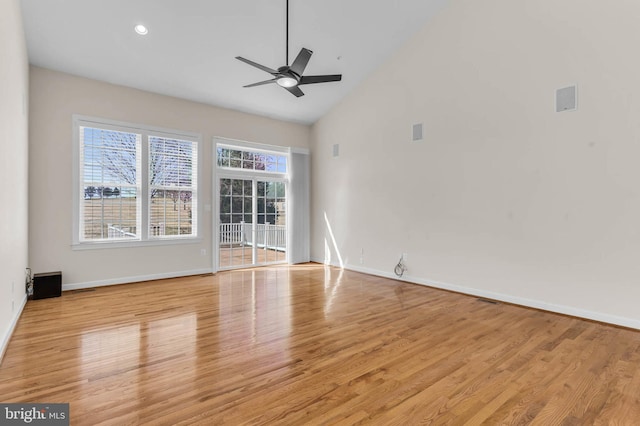 unfurnished living room featuring a ceiling fan, wood finished floors, baseboards, high vaulted ceiling, and recessed lighting