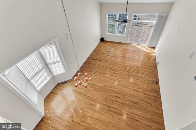 unfurnished dining area featuring wood finished floors and ceiling fan