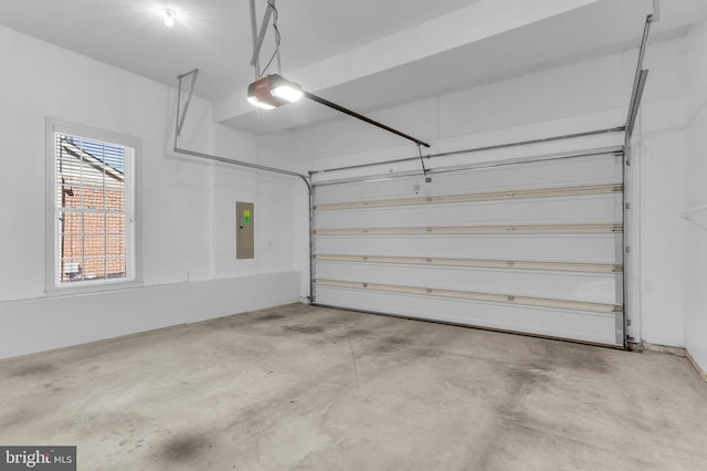 garage with electric panel and a garage door opener