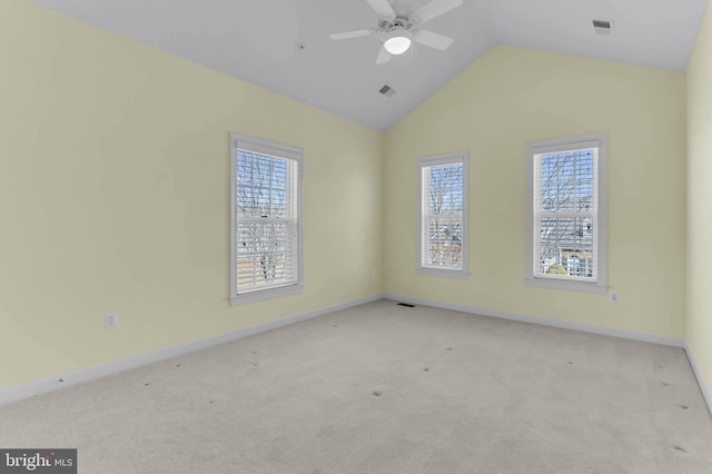 spare room featuring visible vents, plenty of natural light, and carpet flooring