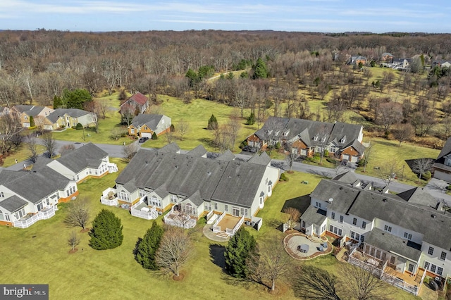 bird's eye view featuring a residential view and a forest view