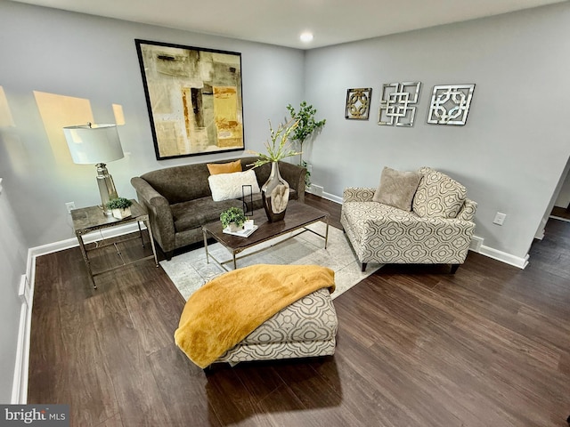 living room with baseboards, wood finished floors, and recessed lighting