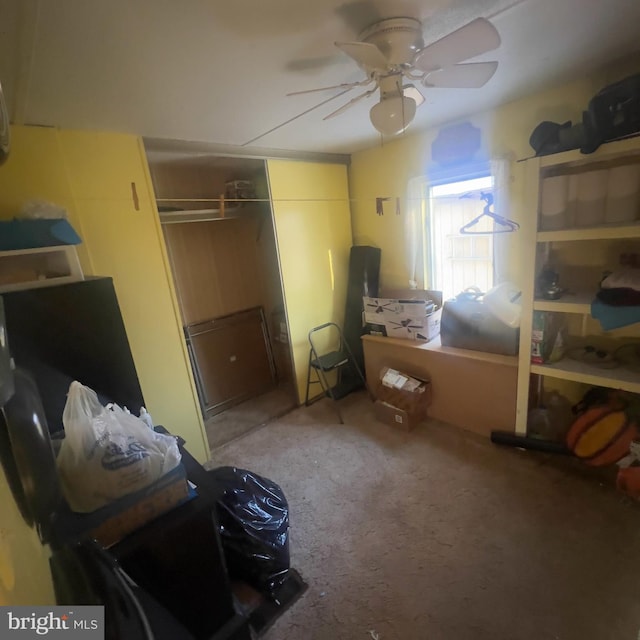 bedroom featuring ceiling fan, a closet, and carpet flooring