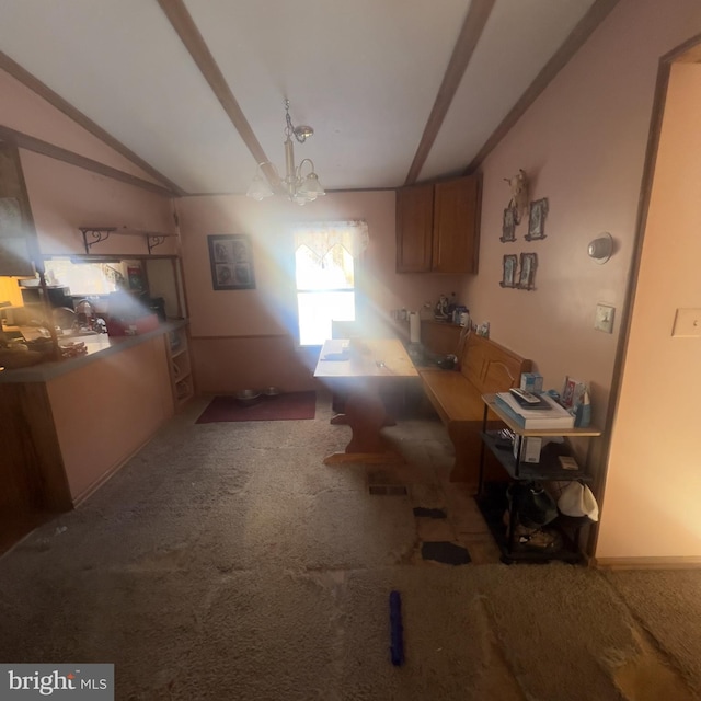unfurnished dining area featuring carpet floors, lofted ceiling, and an inviting chandelier