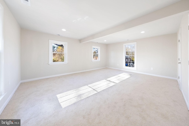 unfurnished room with baseboards, recessed lighting, and light carpet