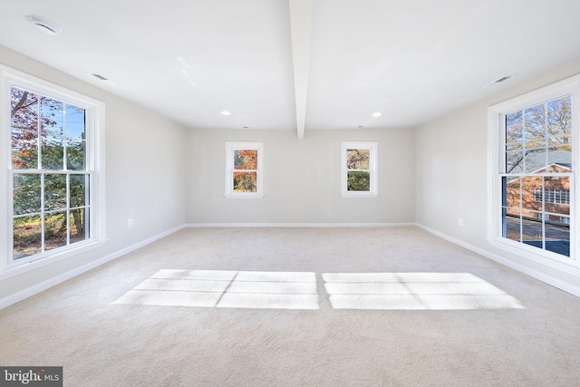 unfurnished room with baseboards, recessed lighting, and light carpet