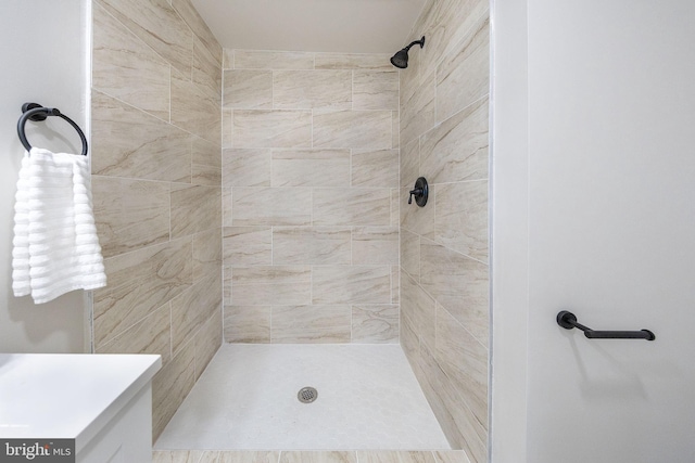 full bathroom with a tile shower