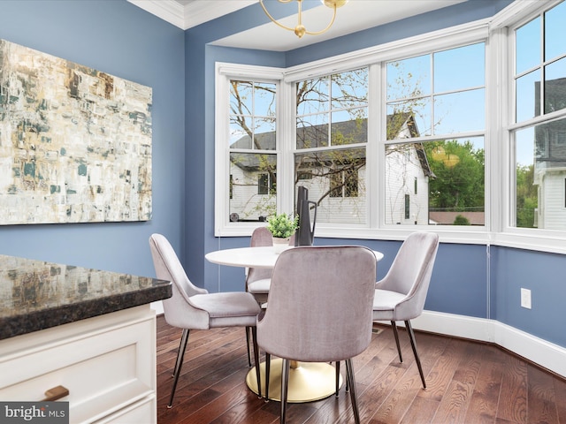 dining space with baseboards, dark wood-style floors, and a wealth of natural light