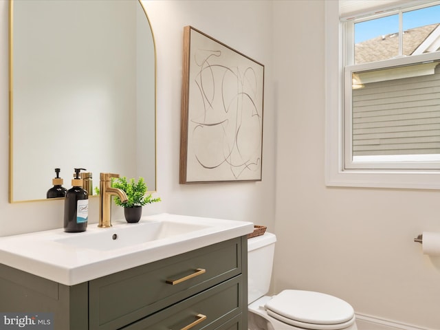half bath with vanity and toilet