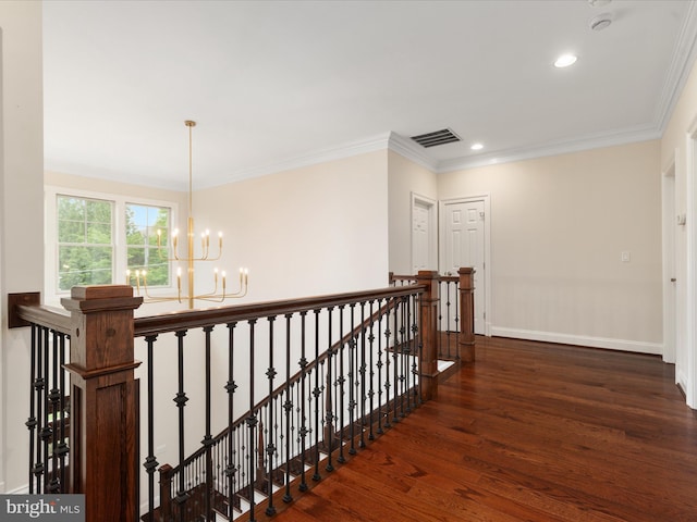 corridor featuring an inviting chandelier, wood finished floors, an upstairs landing, and baseboards