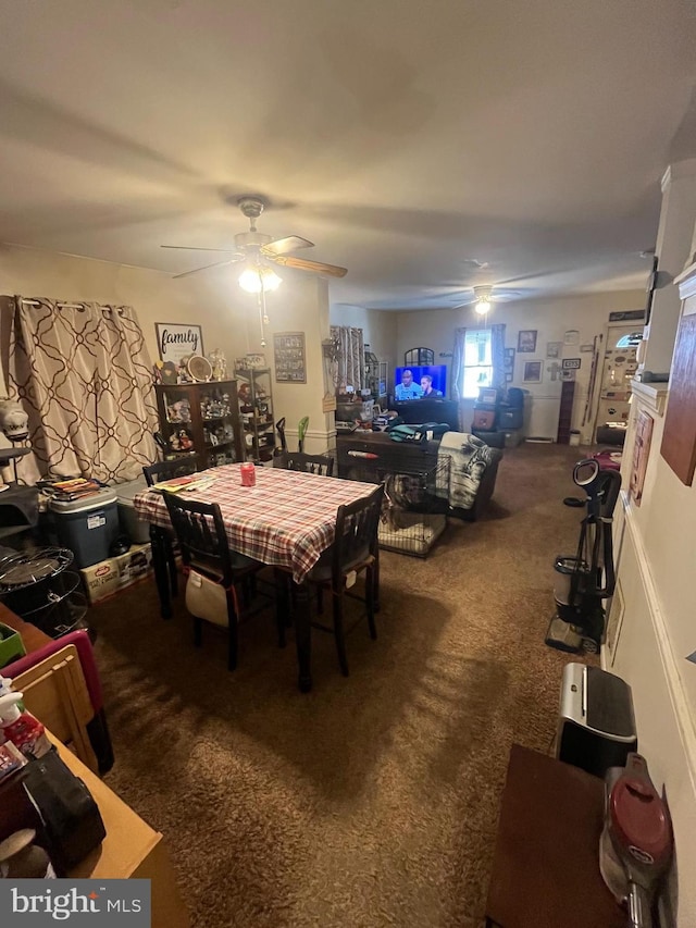 dining space with carpet and ceiling fan