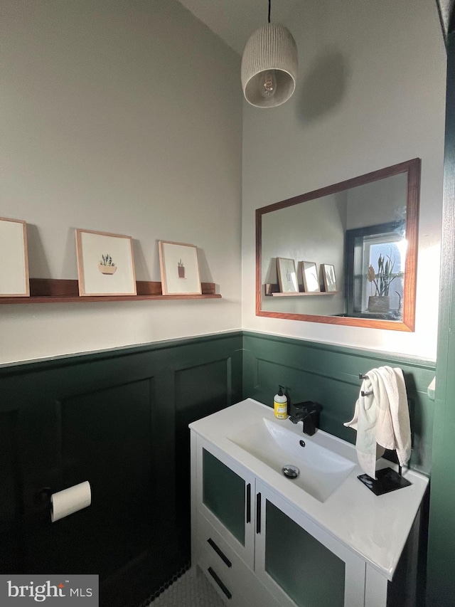 bathroom with wainscoting and vanity