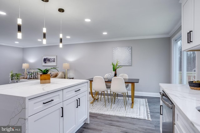 kitchen with dark wood-style flooring, crown molding, recessed lighting, stainless steel dishwasher, and white cabinetry