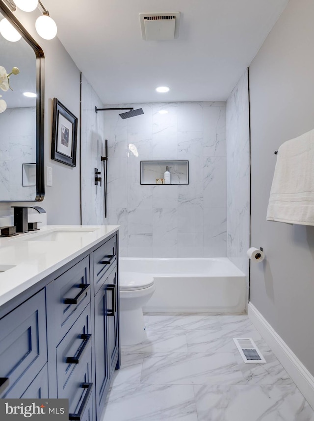 bathroom featuring marble finish floor, a sink, visible vents, and baseboards