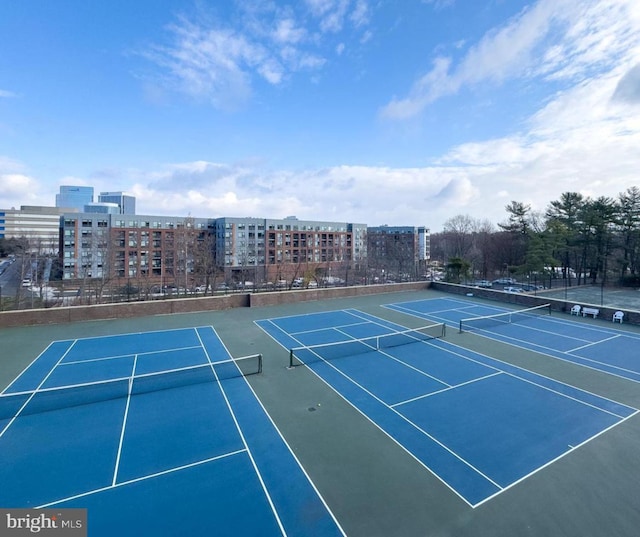 view of tennis court with fence