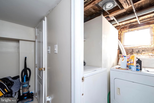 laundry area with laundry area and independent washer and dryer