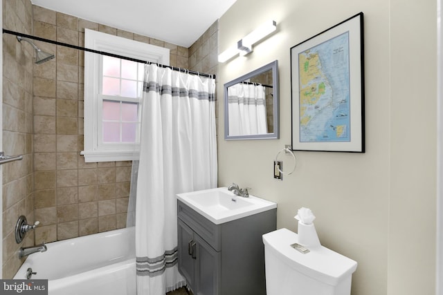 bathroom with toilet, shower / bath combo with shower curtain, and vanity