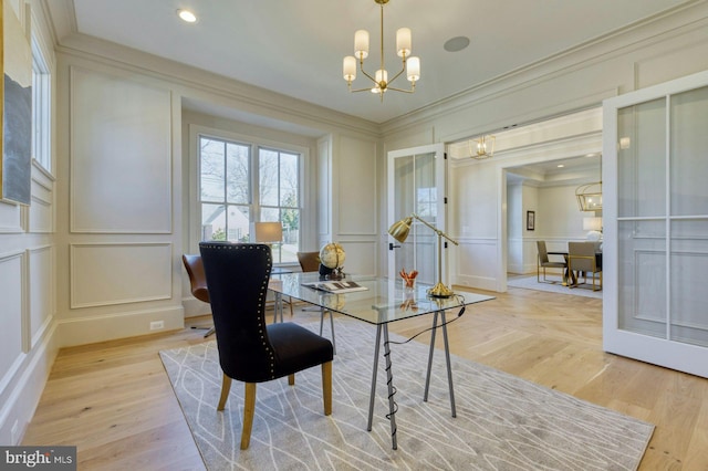 office space featuring a chandelier, recessed lighting, a decorative wall, light wood-style floors, and crown molding