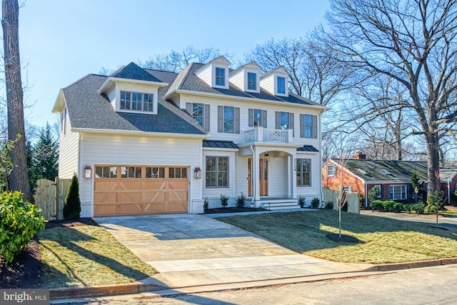 colonial house featuring driveway, a garage, roof with shingles, fence, and a front yard