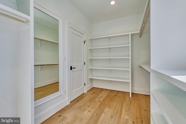 spacious closet with light wood finished floors