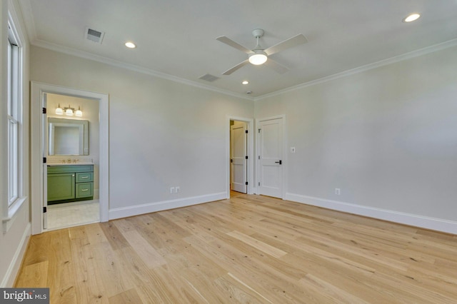 unfurnished bedroom with light wood finished floors, baseboards, visible vents, and ornamental molding