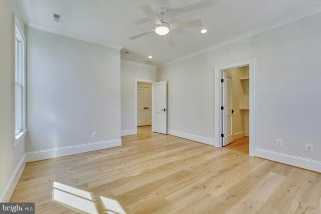 unfurnished bedroom featuring light wood finished floors, baseboards, and ornamental molding