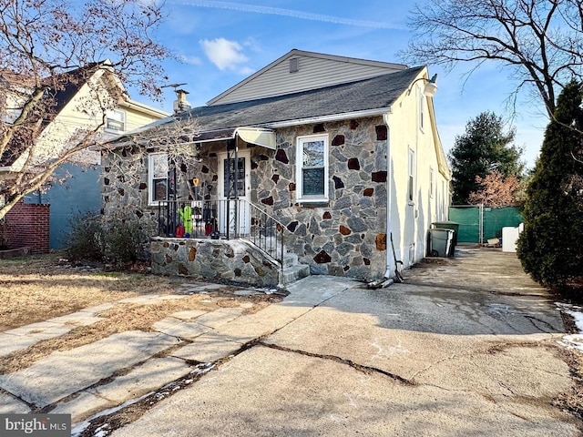 view of front of house with stone siding