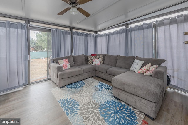 sunroom / solarium with a ceiling fan